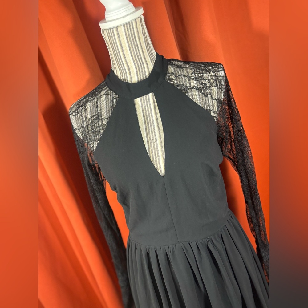 Beautiful long sleeve little black dress with lace sleeves and cut out at chest